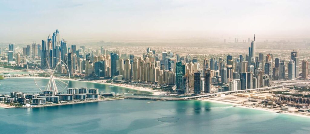 A vibrant view of Dubai’s real estate skyline, highlighting the pros and cons of owning property in Dubai.