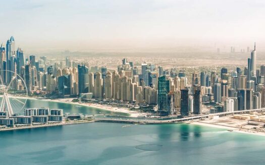 A vibrant view of Dubai’s real estate skyline, highlighting the pros and cons of owning property in Dubai.