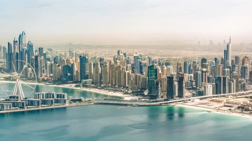 A vibrant view of Dubai’s real estate skyline, highlighting the pros and cons of owning property in Dubai.