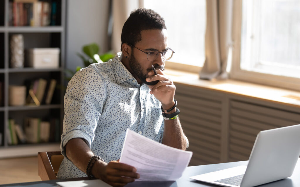 man-pondering-in-front-of-laptop