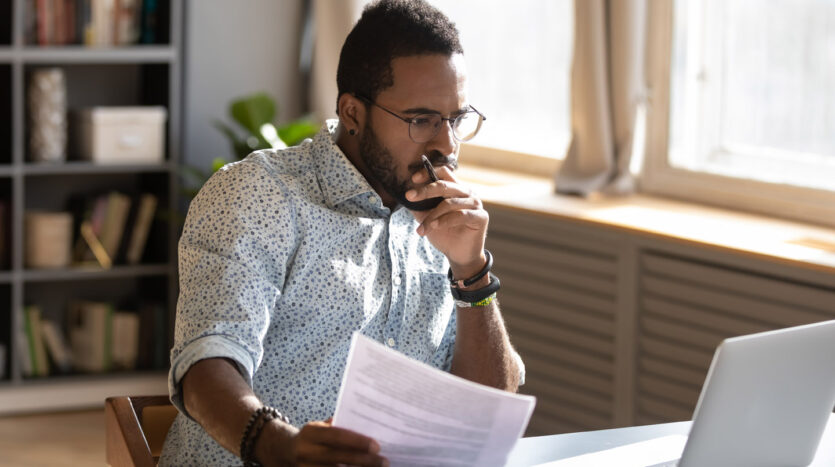 man-pondering-in-front-of-laptop